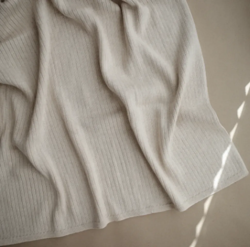 mushie_knitted_ribbed_bab_1.webp Mushie Knitted Ribbed Baby Blanket - Beige Melange